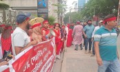 Former GP employees stand on May Day for 5 percent delayed dues